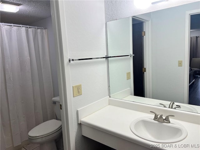 223 Waterscape Dr, Osage Beach, MO 65065 - full bath with vanity, toilet, and a textured ceiling