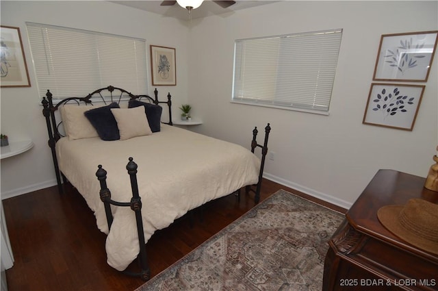 bedroom with dark wood-type flooring and ceiling fan