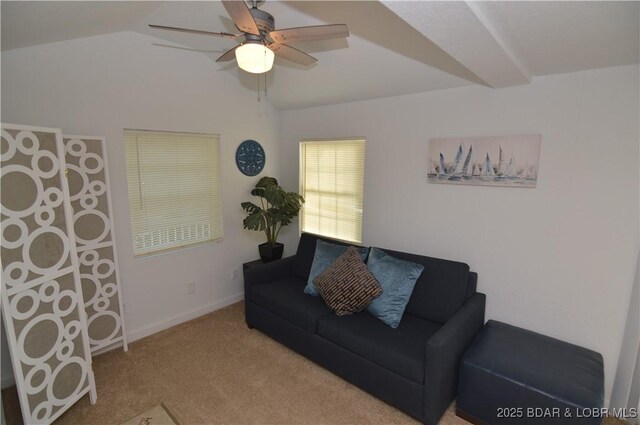 carpeted living room with lofted ceiling and ceiling fan