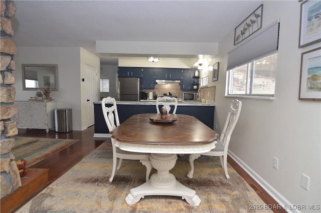 dining room featuring dark hardwood / wood-style floors