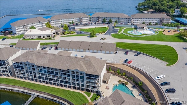 birds eye view of property featuring a water view