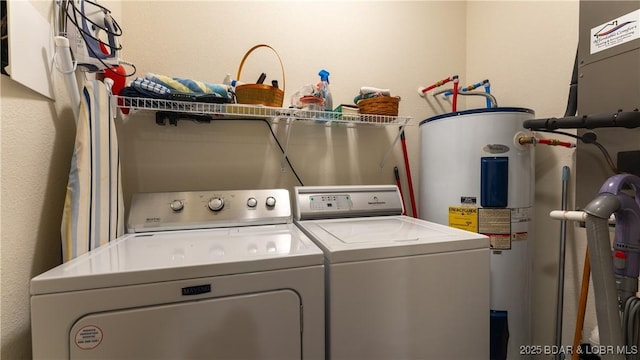 washroom with separate washer and dryer and electric water heater