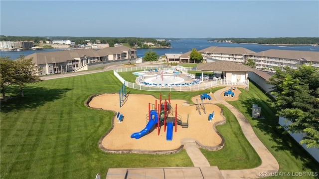 birds eye view of property featuring a water view