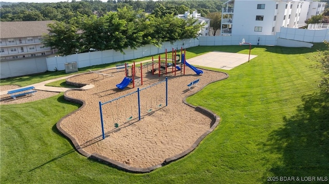 view of home's community with a yard and a playground