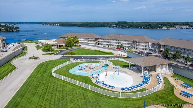 birds eye view of property featuring a water view