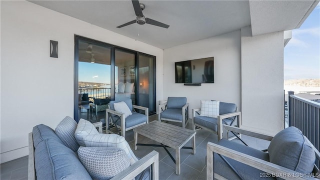 view of patio featuring ceiling fan, an outdoor hangout area, and a balcony