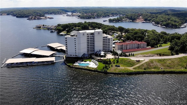 birds eye view of property with a water view