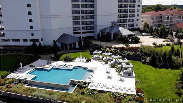 view of pool with a gazebo, a lawn, and a patio area