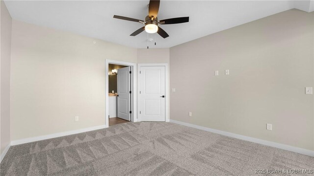 carpeted empty room with ceiling fan