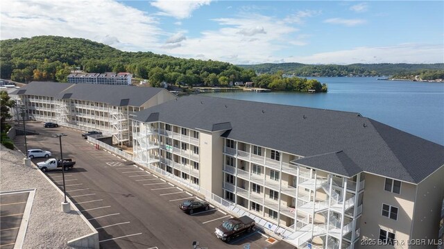 birds eye view of property featuring a water view