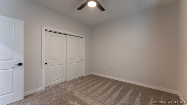 unfurnished bedroom featuring a closet, ceiling fan, and carpet flooring