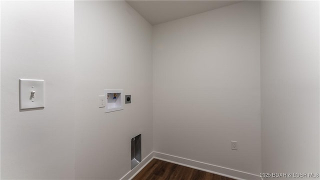 washroom with dark hardwood / wood-style flooring, hookup for a washing machine, and electric dryer hookup