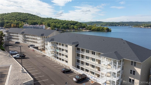 birds eye view of property with a water view