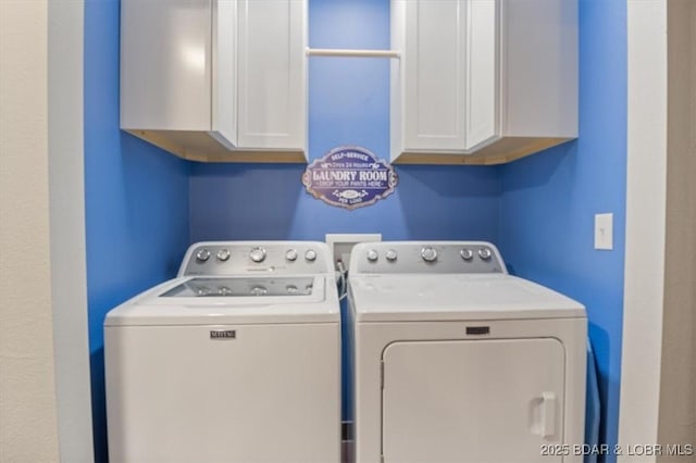 laundry area featuring cabinets and independent washer and dryer