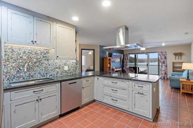 kitchen featuring dishwasher, sink, backsplash, island exhaust hood, and kitchen peninsula