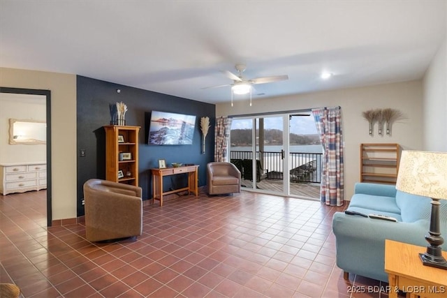 tiled living room featuring ceiling fan