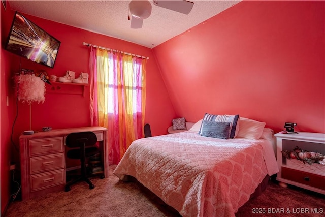 carpeted bedroom with ceiling fan and a textured ceiling