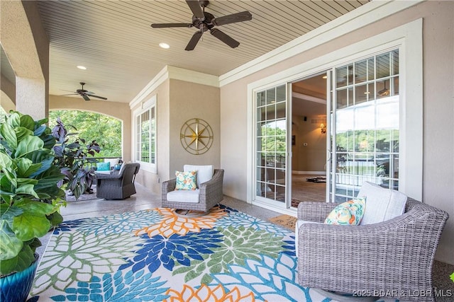 view of patio featuring an outdoor living space and ceiling fan