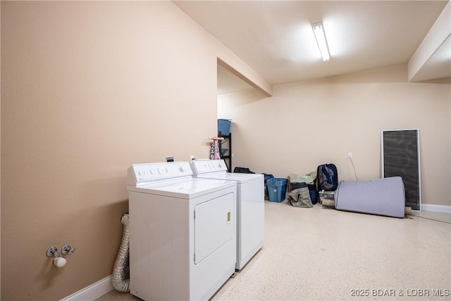 laundry room featuring washing machine and dryer