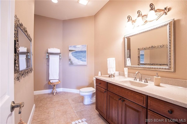 bathroom featuring vanity, toilet, and tile patterned flooring