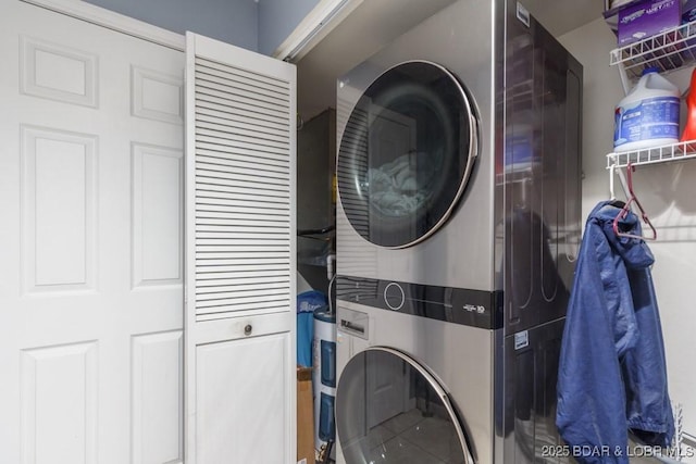 laundry area featuring stacked washer and dryer