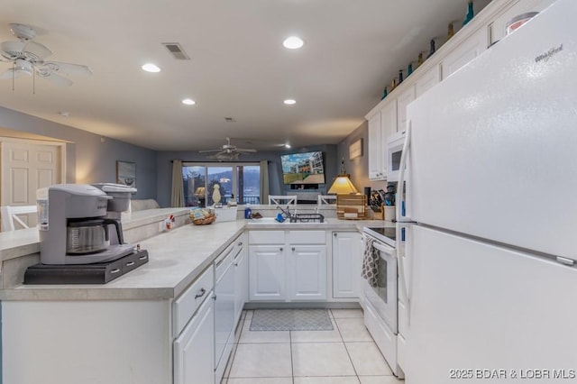 kitchen featuring white cabinetry, white appliances, kitchen peninsula, and light tile patterned flooring