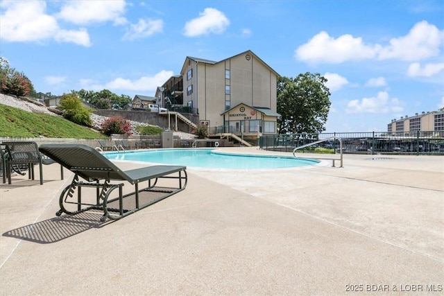 view of pool featuring a patio area