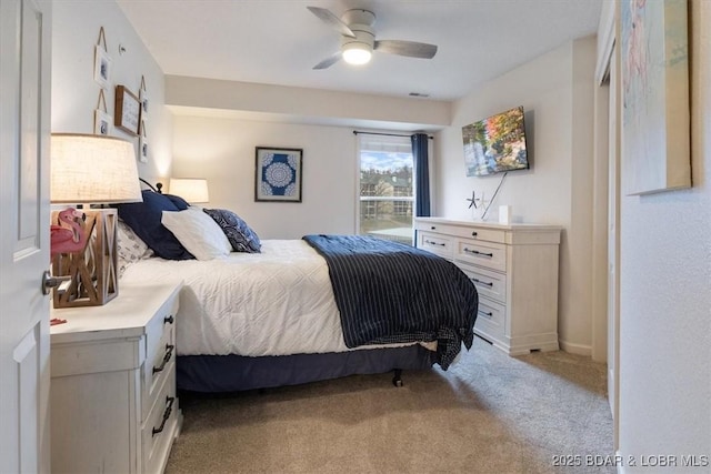 carpeted bedroom featuring ceiling fan