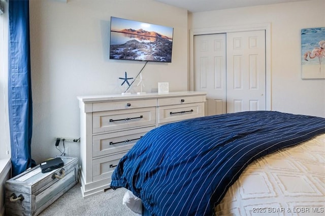 carpeted bedroom with a closet