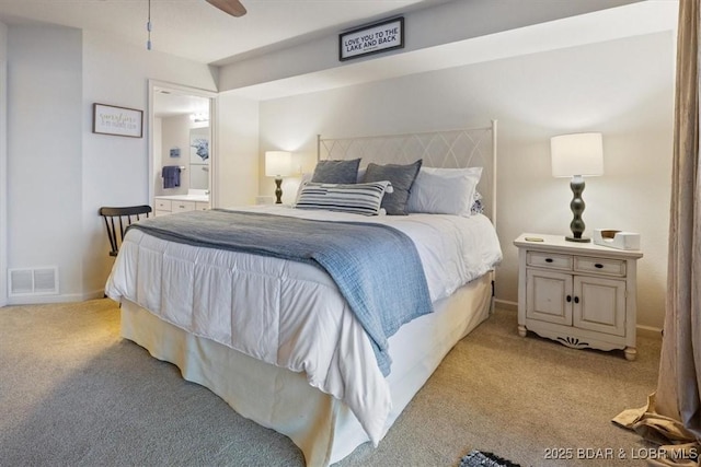 carpeted bedroom with ensuite bath