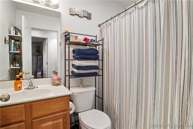 bathroom with vanity, toilet, and a shower with shower curtain