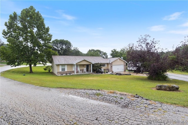 ranch-style home with a garage and a front yard