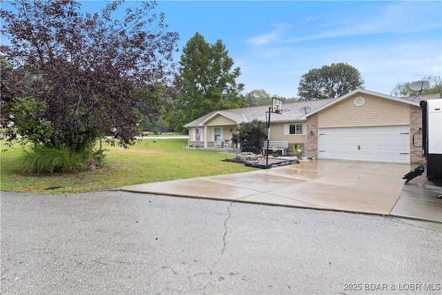 view of front of property featuring a garage and a front yard