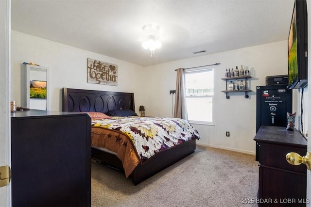 bedroom with light colored carpet