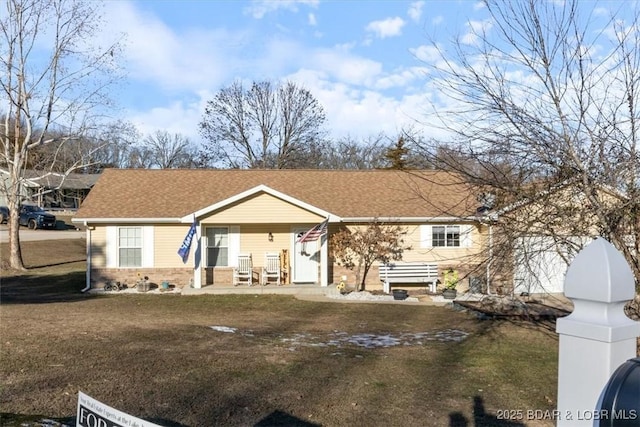 ranch-style house featuring a front yard and a porch