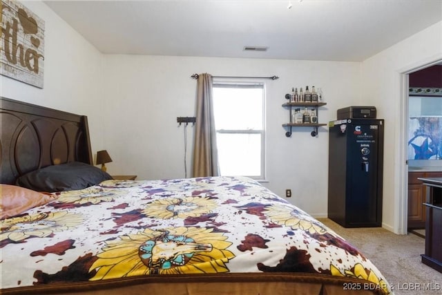 bedroom featuring light carpet