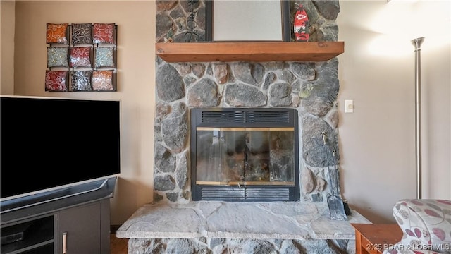 room details featuring a stone fireplace