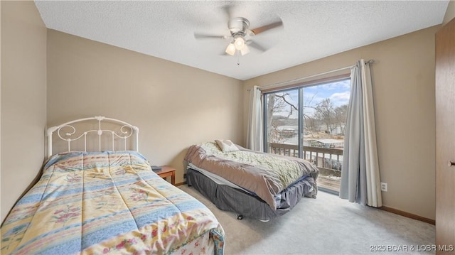 bedroom with ceiling fan, carpet floors, access to outside, and a textured ceiling