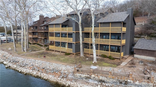 view of building exterior with a water view