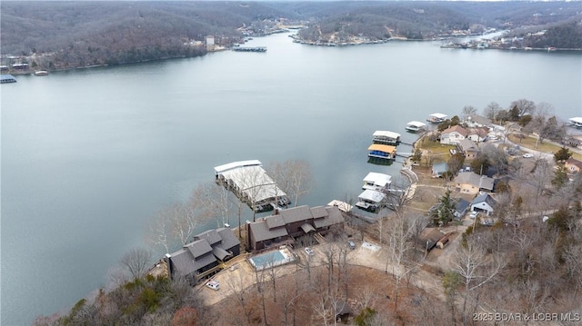 birds eye view of property featuring a water view