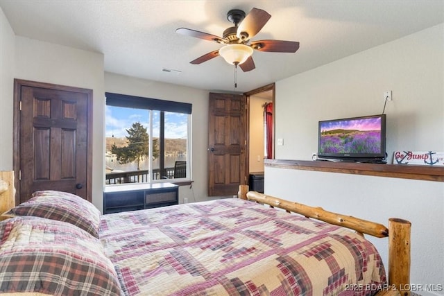 bedroom featuring ceiling fan and access to outside