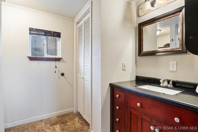 bathroom with vanity and crown molding