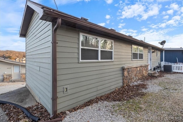 29556 Hunter Rd, Gravois Mills, MO 63069 - view of side of home with a central AC unit