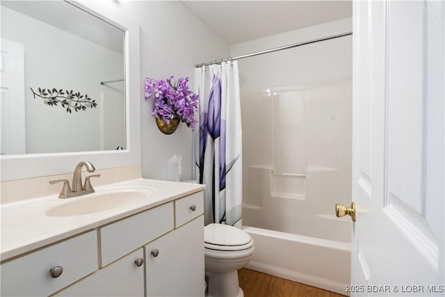 full bathroom featuring shower / bathtub combination with curtain, vanity, wood-type flooring, and toilet