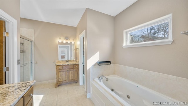 bathroom with vanity, tile patterned floors, and plus walk in shower