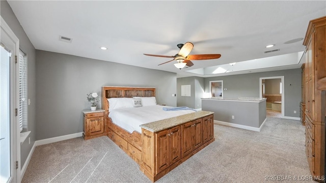 unfurnished bedroom featuring ceiling fan, a skylight, and light carpet