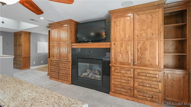 living room featuring light colored carpet and ceiling fan