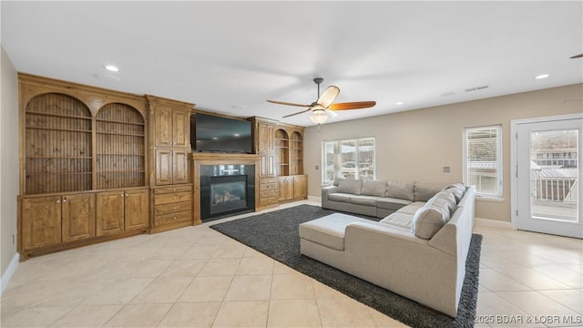 living room with light tile patterned flooring and ceiling fan