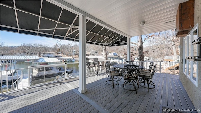 wooden deck with a water view