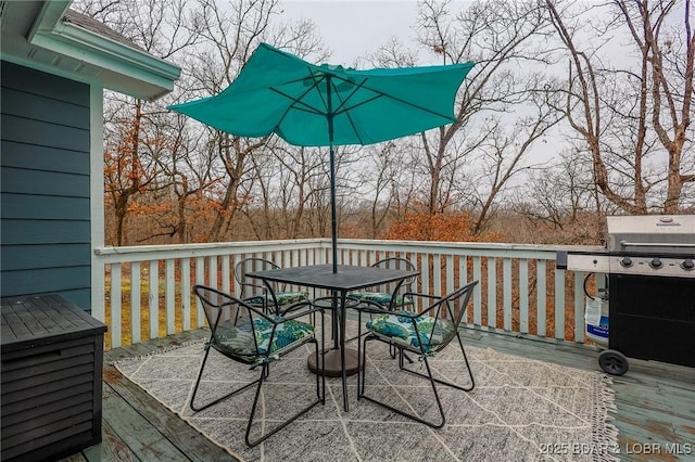 wooden deck featuring outdoor dining space